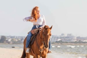 Horseback Riding on the Beach at Sunset