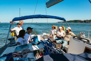 Lisbon: City Skyline Sailboat Cruise with Drink and Snacks