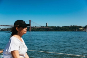 Lisbon: City Skyline Sailboat Cruise with Drink and Snacks