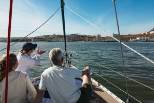 Lisbon: City Skyline Sailboat Cruise with Drink and Snacks