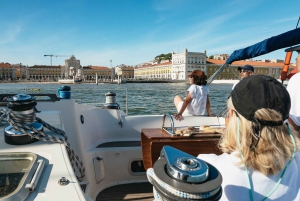 Lisbon: City Skyline Sailboat Cruise with Drink and Snacks
