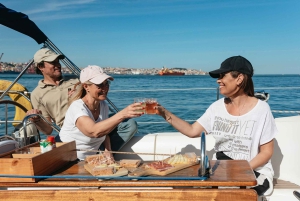 Lisbon: City Skyline Sailboat Cruise with Drink and Snacks