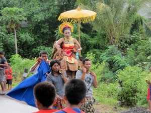 Girls being carried during a ceremony