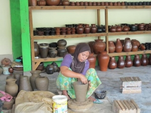 Local woman making clay pots