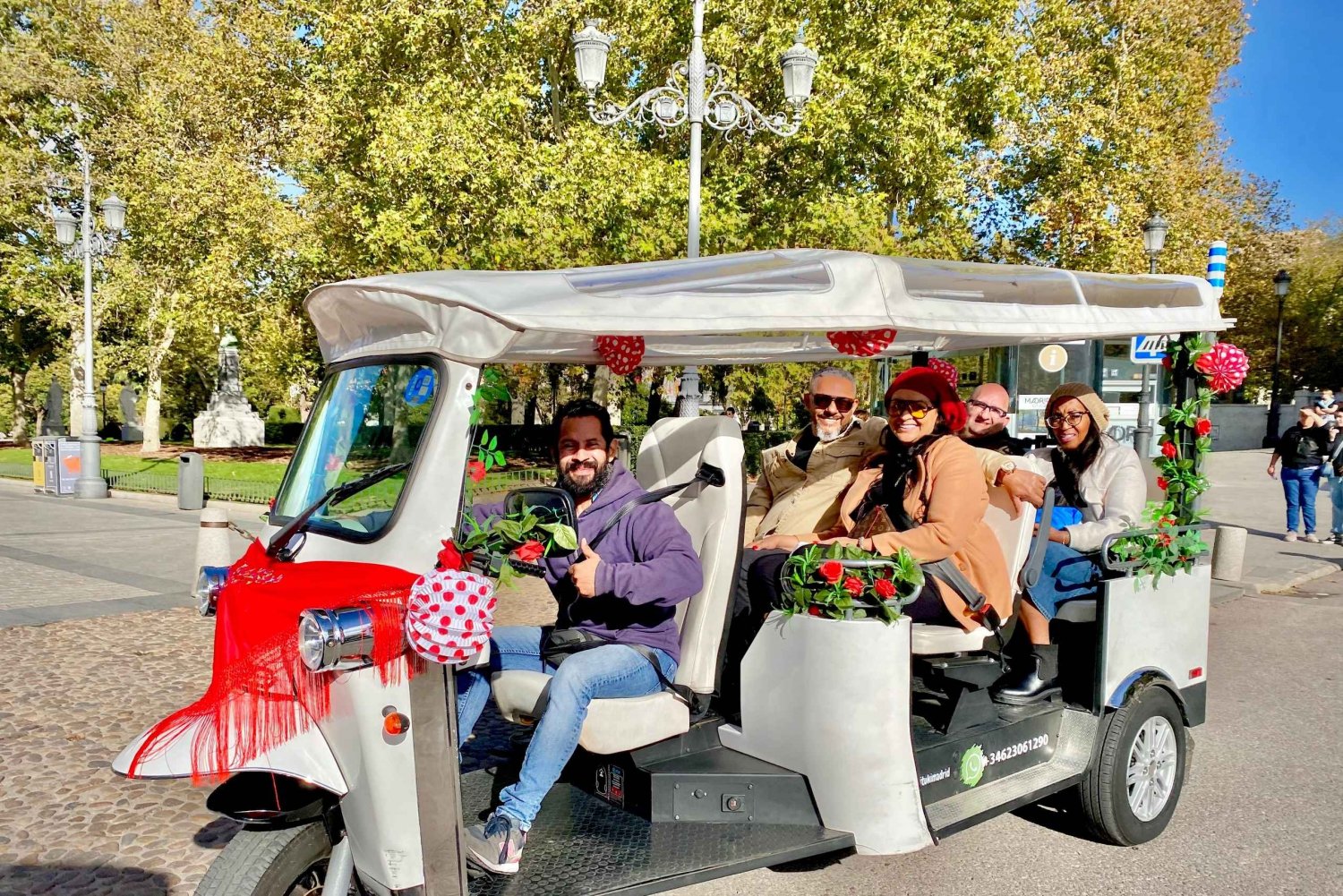 Madrid: TukTuk Tour experince with Spanish Fair Decorations