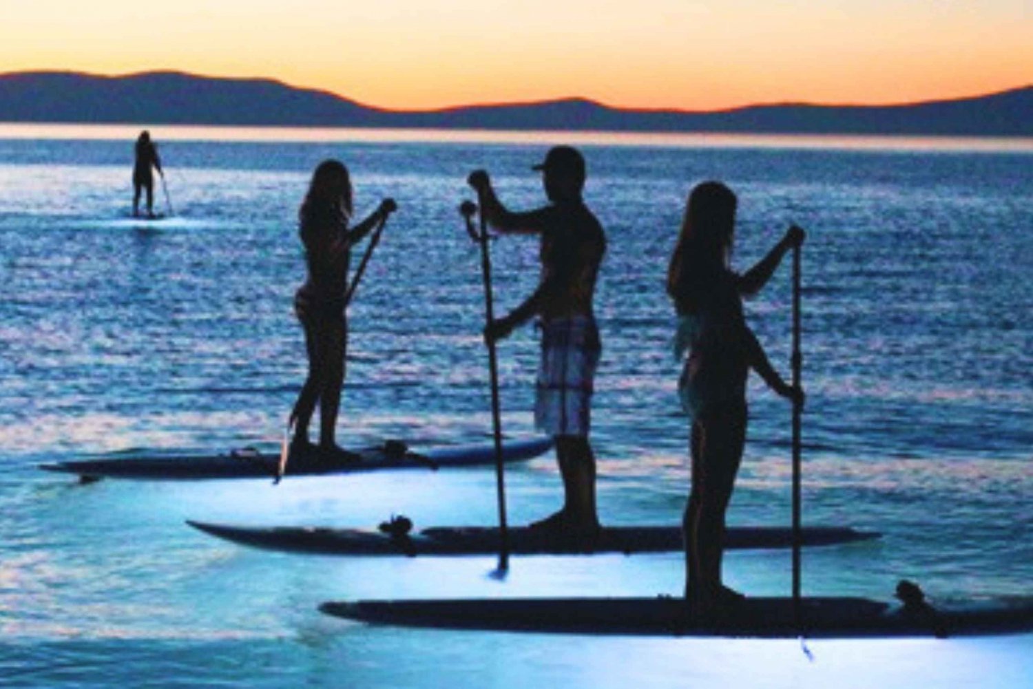 Paddle Surf with Led lights at sunset in Menorca