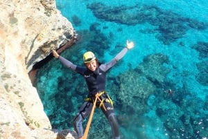 Sea cave with abseiling (rappel)