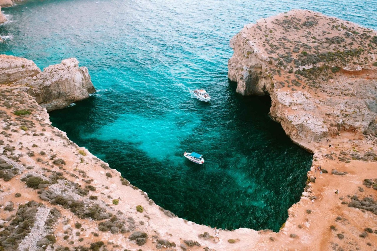 From Mellieha: Round Comino Cruise with Wine and Water