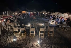 Paseo en camello al atardecer con cena y espectáculo (grupo pequeño)