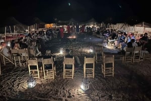 Paseo en camello al atardecer con cena y espectáculo (grupo pequeño)