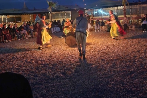 Woestijntocht met diner, show en kamelenrit bij zonsondergang