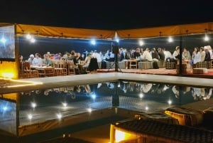 Marrakech: Giro in cammello e cena con spettacolo di fuoco ad Agafay