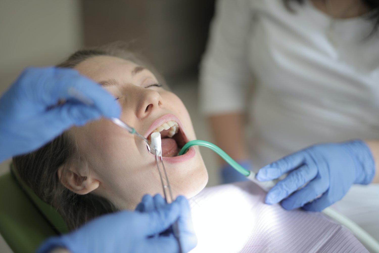 A patient receiving dental care from an English speaking dentist in Korea