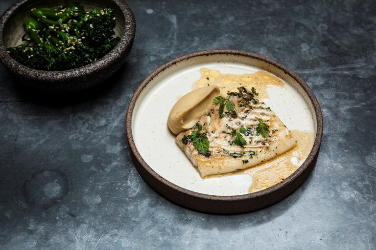 Oyster sauce-baked brill with sesame broccoli and miso chickpea puree