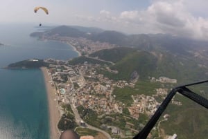 Bečići: Tandem Paragliding Experience with Pickup