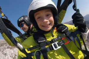 Bečići: Tandem Paragliding Experience with Pickup