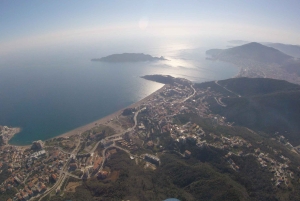 Bečići: Tandem Paragliding Experience with Pickup