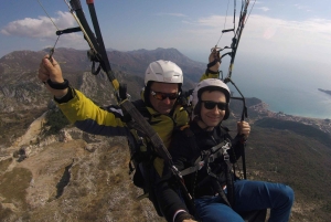 Bečići: Tandem Paragliding Experience with Pickup