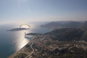 Bečići: Tandem Paragliding Experience with Pickup
