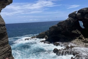 From San Juan: Cave of the Taino Indian Trek and Beach Tour