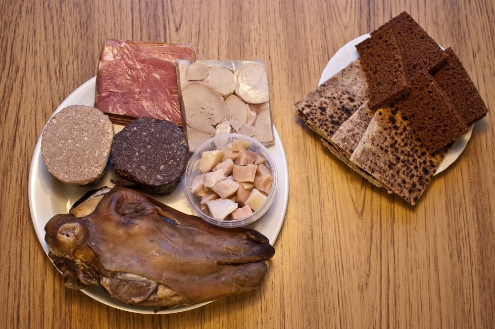 Grab a plate, dinner is served! Clockwise we see SviÃ°, liverwurst and blood pudding, HangikjÃ¶t, ram