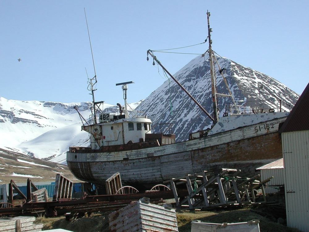 An old fishing boat under renovation is a very typical thing to see in SiglufjÃ¶rÃ°ur