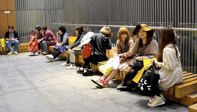 Japanese tourists in front of the ?Forever 21? store, Myengdong.  