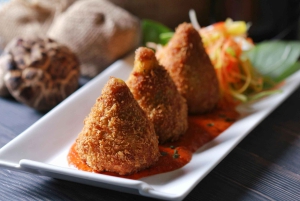 Wine tasting and arancini in a restaurant in Piazza Armerina