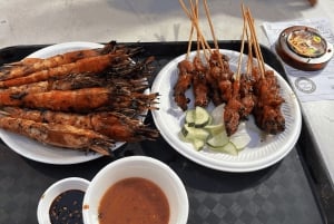 Tour nocturno con firma: Paseo por el puerto deportivo con degustación de comida