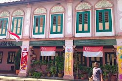 Decorated house in Little India with National Day flags