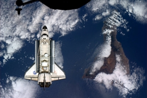 Space shuttle Atlantis docking over Tenerife