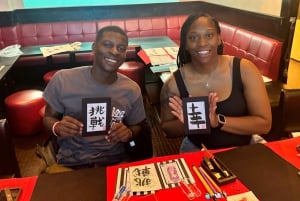 Tokyo: Kalligrafi på kanji-fläkt och rulle med dryck