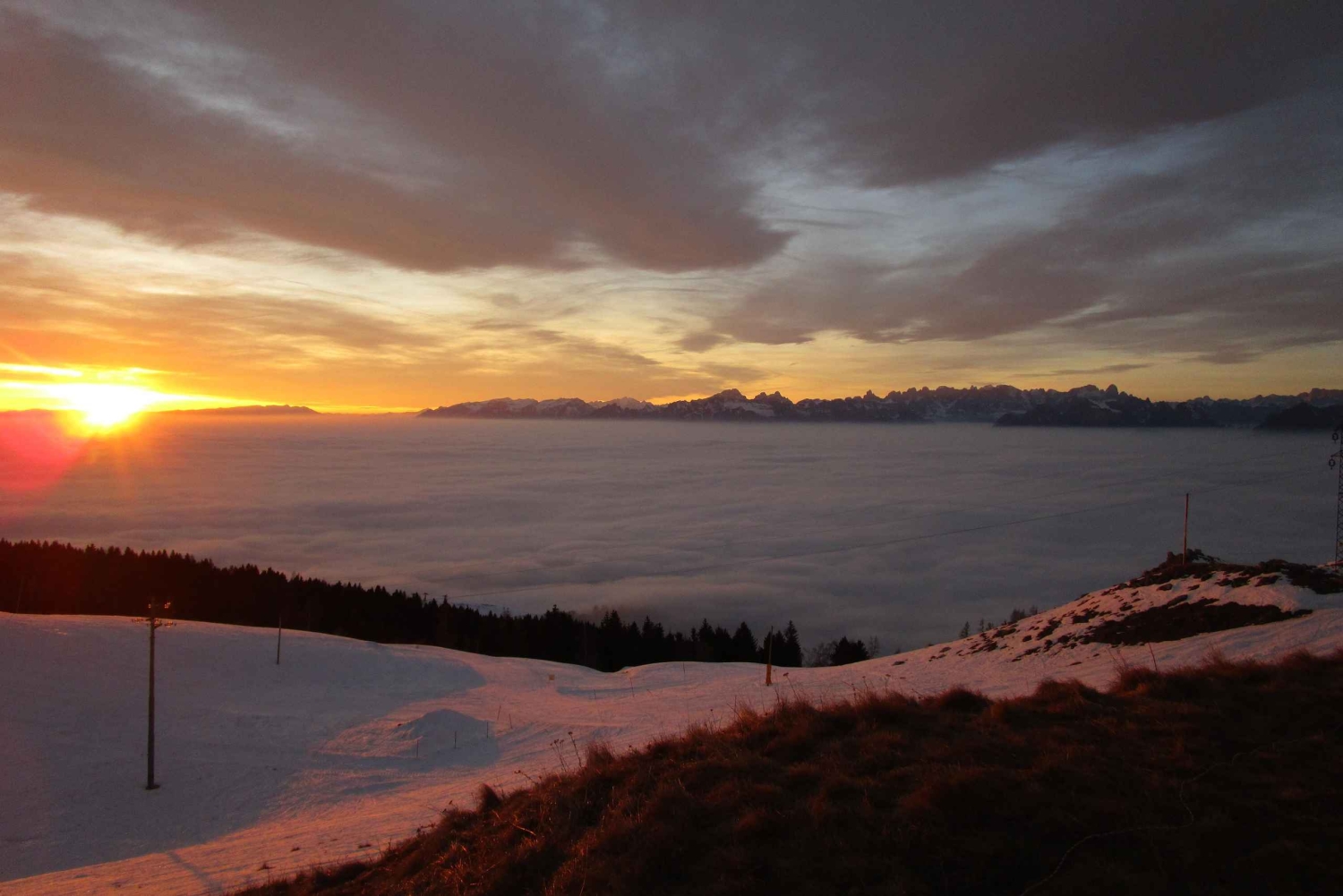 Sunset and night winter hike between Dolomites and Venice
