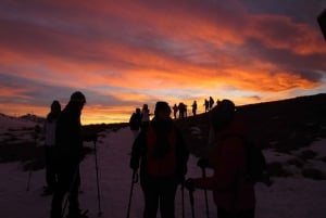 Sunset and night winter hike between Dolomites and Venice