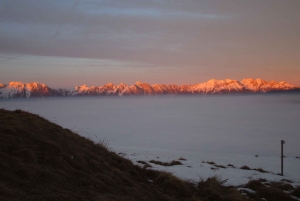 Sunset and night winter hike between Dolomites and Venice