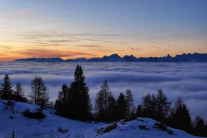 Sunset and night winter hike between Dolomites and Venice