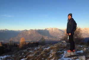 Sunset and night winter hike between Dolomites and Venice