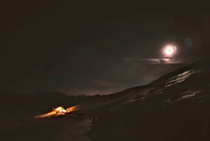 Sunset and night winter hike between Dolomites and Venice