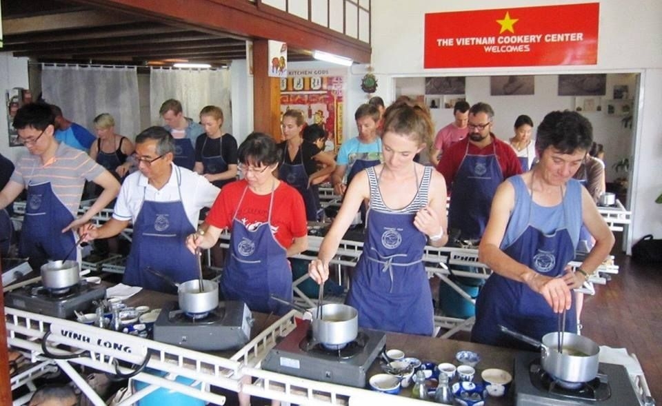 Everybody is concentrating on frying spring rolls