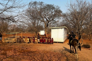 Victoria Falls: African Village Community Tour on Horseback