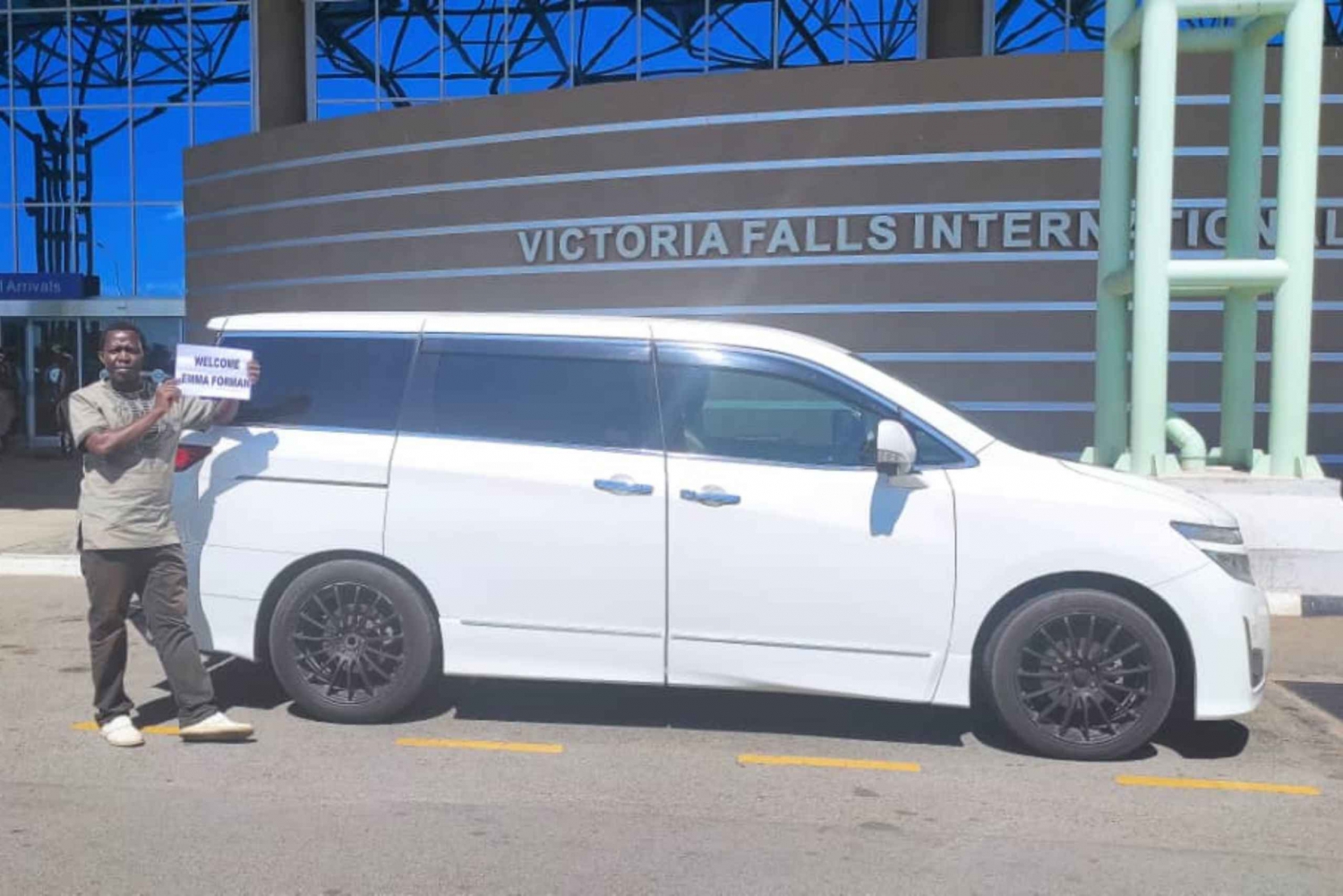 Victoria Falls Airport: Small Group Airport Transfer in Van